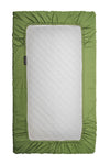 A green, fabric-bordered DockATot Sorona foam core mattress isolated on a white background. The mattress features a central white quilted section, zipper on one side, and a visible brand tag.