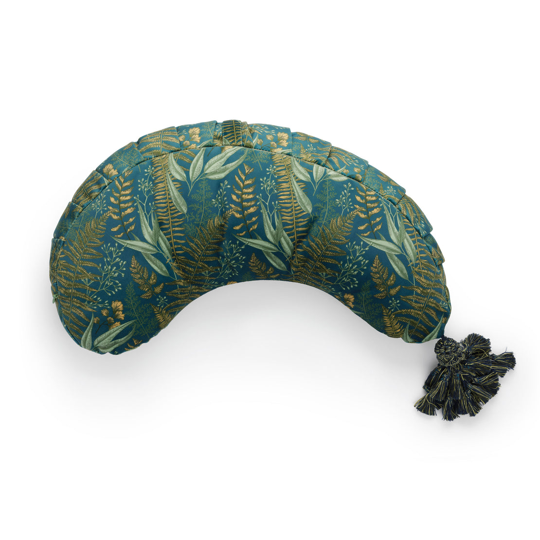 A vibrant teal La Maman Wedge - Navy Night Falls nursing pillow decorated with a golden tropical leaf pattern, featuring a tasseled embellishment on one end. The pillow is shaped to provide neck and breastfeeding support and is isolated on a white background.